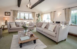 Comfortable TV room with log burner